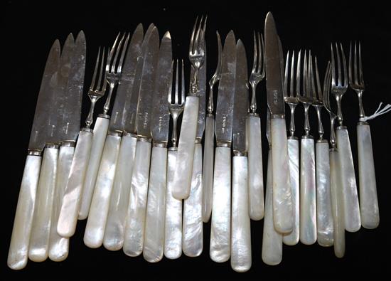 A set of twelve pairs of George V mother of pearl handled silver dessert eaters,